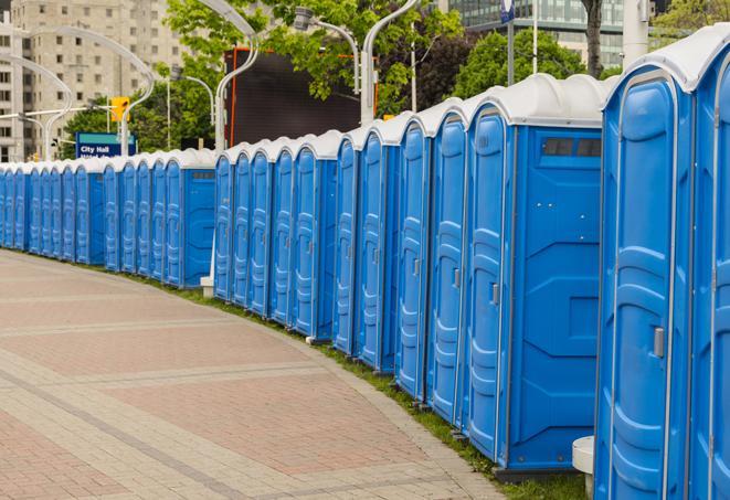 a row of sleek and modern portable restrooms at a special outdoor event in Clarksburg